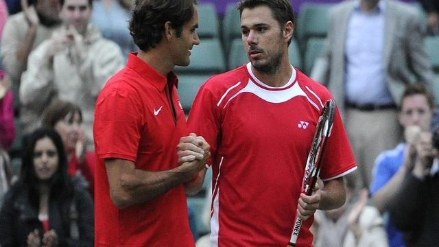 Roger Federer et Stanislas Wawrinka se sont qualifiés pour le double aux JO de Londres.  [Jean-Christophe Bott-Keystone]