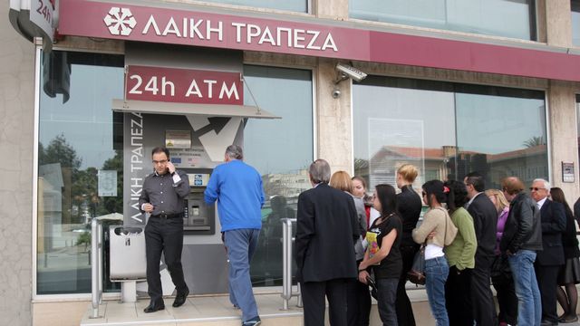 Laiki, la deuxième banque du pays, va disparaître. [Hasan Mroue - AFP]