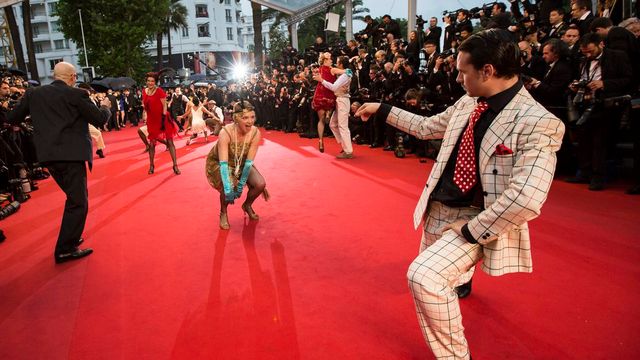 Leonardo DiCaprio a ouvert le 66e Festival de Cannes, sous la pluie. [Keystone]