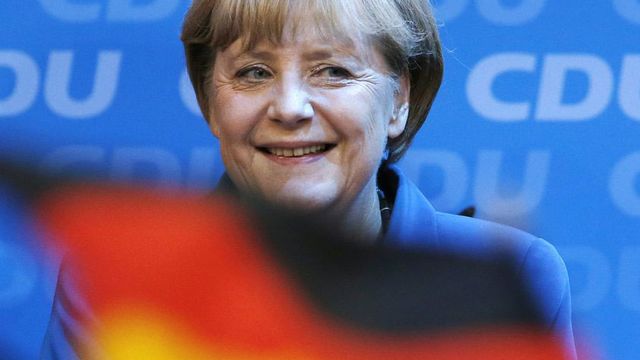 Angela Merkel savoure sa large victoire. [Michael Sohn - AP/Keystone]