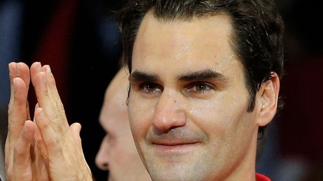 Toute l'émotion sur le visage et dans les yeux de Roger Federer. [Christophe Ena - Keystone]