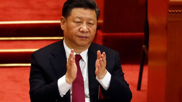 C'est dimanche que le président chinois Xi Jinping devrait assurément devenir dirigeant à vie. [Ng Han Guan - Keystone]