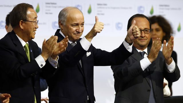 French foreign minister and President of the COP21 Laurent Fabius, center, applauds while United Nations Secretary General Ban Ki-moon, left, and French President Francois Hiollande applaud after the final conference of the COP21, the United Nations conference on climate change, in Le Bourget, north of Paris, Saturday, Dec.12, 2015. Nearly 200 nations adopted the first global pact to fight climate change on Saturday, calling on the world to collectively cut and then eliminate greenhouse gas pollution but imposing no sanctions on countries that don't. (AP Photo/Francois Mori) [François Mori - AP]