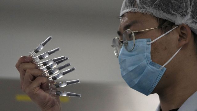 La Chine souhaite vacciner 50 millions de personnes d'ici février. [Ng Han Guan - Keystone/AP Photo]