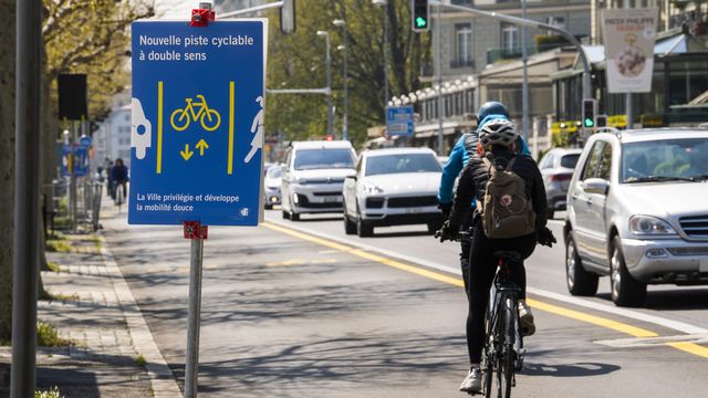 Le canton de Genève veut davantage développer les voies cyclables. [Martial Trezzini - KEYSTONE]