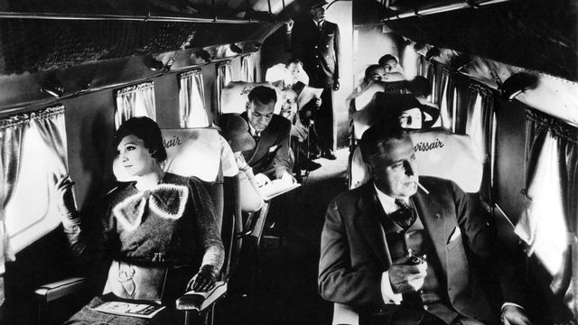 Passagers à bord d'un avion Swissair dans les années 30. [Photopress-Archiv/RIA/Str - KEYSTONE]