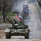 Une colonne de chars des forces pro-russes dans les rues de Marioupol, le 21 avril 2022.  [Chingis Kondarov - Reuters]