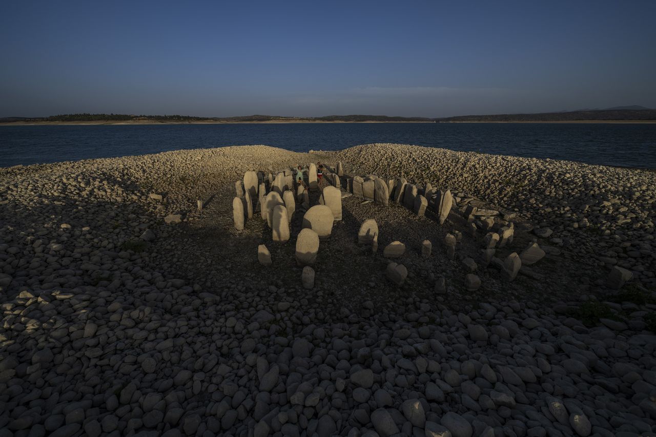 In the Valdecañas reservoir in Extremadura (west), a megalithic complex - baptized "spanish stonehenge"in reference to the English prehistoric site - resurfaced on an islet due to drought. [AP Photo/Manu Fernandez - Keystone]