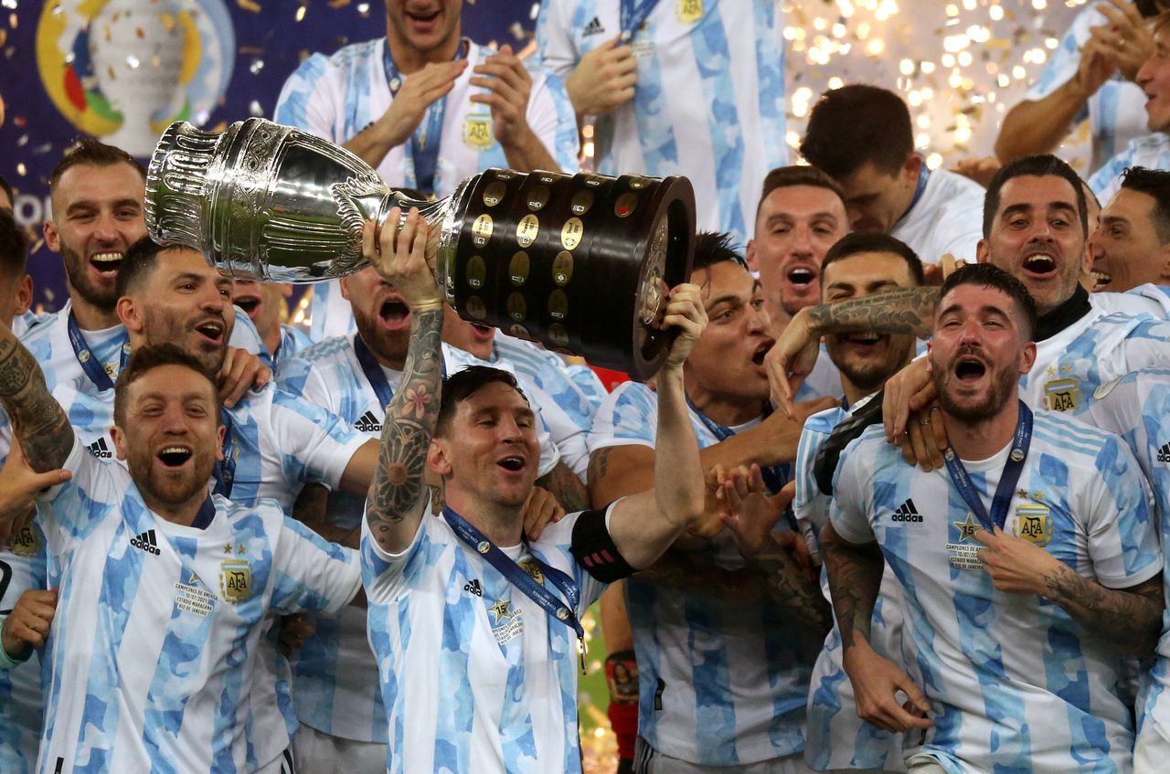 Lionel Messi lifts the 2021 Copa America trophy with his compatriots. [Imago]